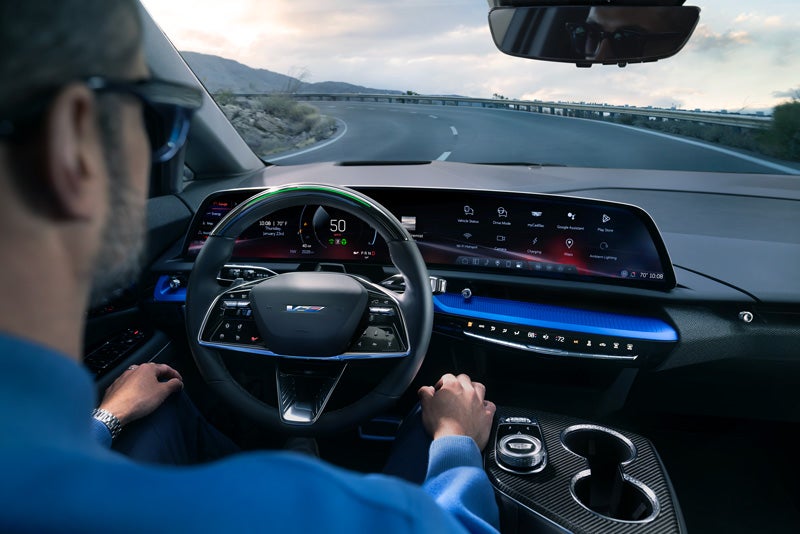 Front View of the 2026 OPTIQ-V Driving Through the Dusk Utilizing its Headlights | Devan Lowe Buick Cadillac GMC in RAINBOW CITY AL